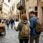 Travelers exploring historic European city street