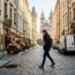 1774513542611_Traveler on cobblestone street near Central Europe landmark 85x85