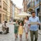 Family walking along European city street