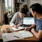 Couple planning Europe trip at kitchen table