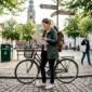 Traveler in historic plaza with eco tour map