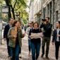 Group walking city street with guide