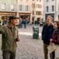 Local guide leads tourist group in historic European city