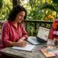 Woman planning nature tour at home desk