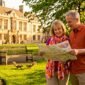 Travelers exploring historic city plaza