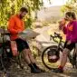 Cyclists pausing for map check on country road
