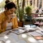 1782135420620_Woman planning Europe travel itinerary at home 85x85