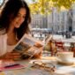 1782783249688_Traveler planning Austria trip in a cafe 85x85