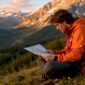 1782956080671_Hiker with map in Austrian Alps at sunrise 85x85