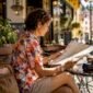 1783087525214_Traveler sitting on bench viewing city landmarks 85x85