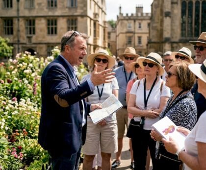 Tour guide speaking to outdoor tourist group