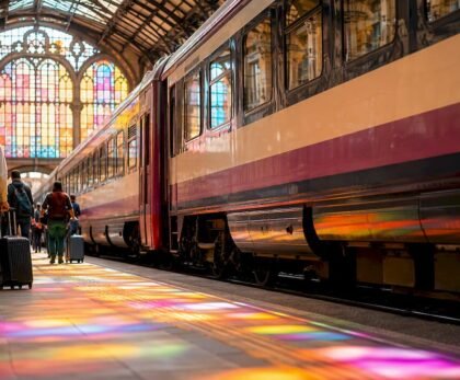 Intercity train departing historic station