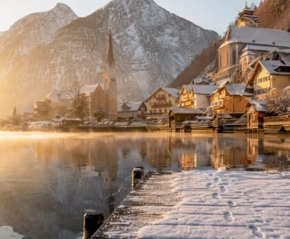Snowy Hallstatt village lakeside winter morning