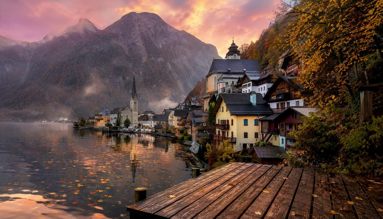 Hallstatt village by misty lake at sunrise