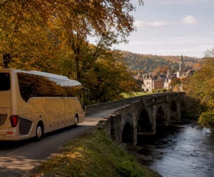 Tour bus driving through European countryside