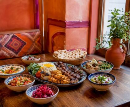 Halal Middle Eastern food spread on wooden table