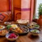 1787567609485_Halal Middle Eastern food spread on wooden table 85x85