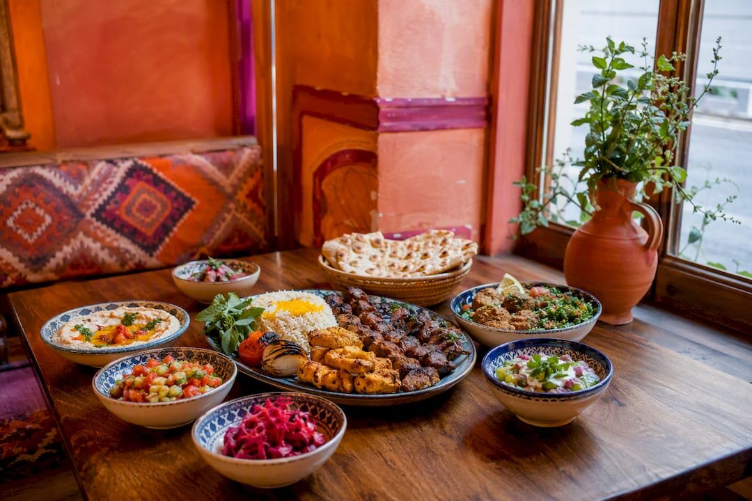 Halal Middle Eastern food spread on wooden table