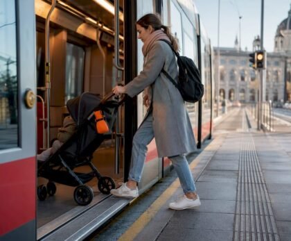 Parent boarding Vienna tram with stroller