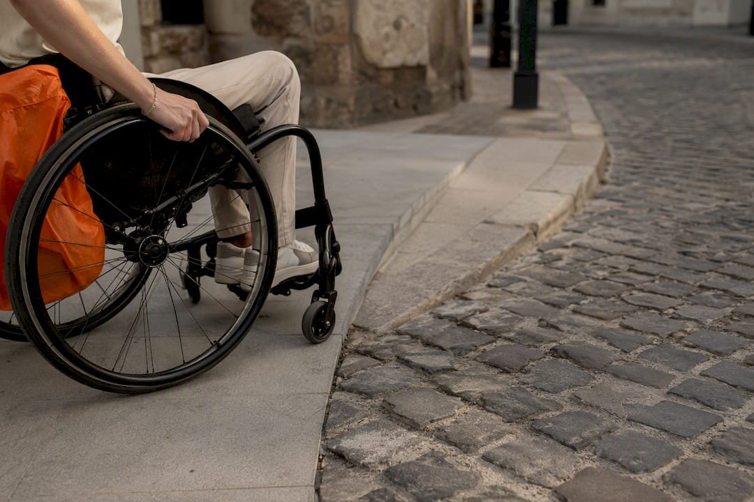 Wheelchair approaching Budapest cobblestone transition