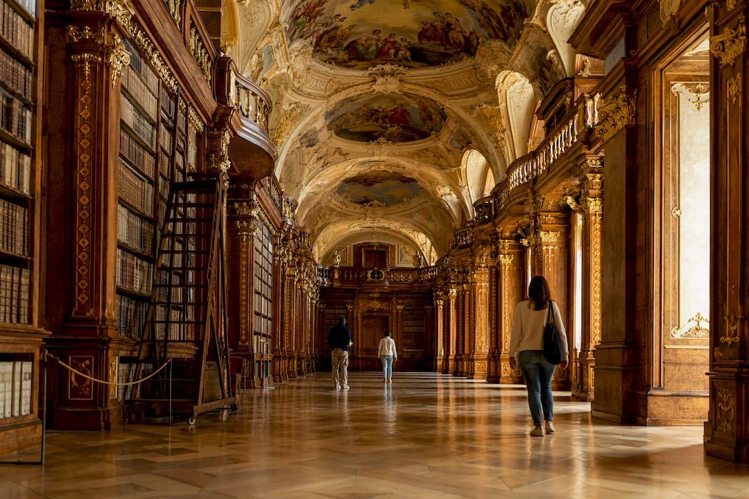Visitors inside Melk Abbey library