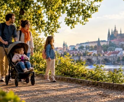 Family strolling through a Prague park